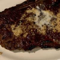 New York Prime Strip Steak (16 Oz) · USDA prime aged New York strip steak grilled to your desired temperature.