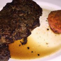 Peppercorn Ribeye Steak · Boneless 14 oz. ribeye steak, pan seared with crushed black peppercorns & garlic grilled to ...