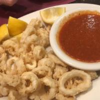 Fried Calamari · With tarter sauce. served with bowl of soup or salad rice or potato and vegetable.