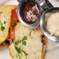 Chicken Quesadilla · Served with peppers, onions, tomatoes and cheese.