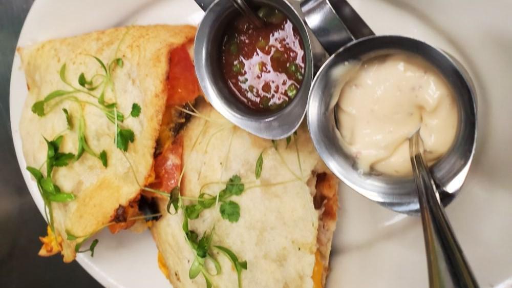 Chicken Quesadilla · Served with peppers, onions, tomatoes and cheese.
