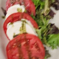 Caprese Salad · Made with mozzarella, basil, and garlic olive oil.