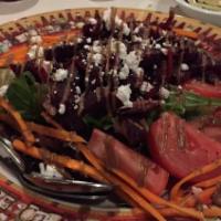 Marinated Beet Salad · Served with crumbled bleu cheese and a balsamic drizzle.