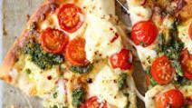 Chicken Pesto Pizza · Chicken and tomatoes with pesto sauce and fresh mozzarella