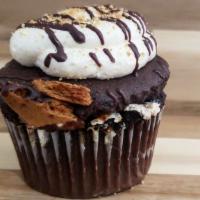 S'Mores Cupcake · If you love s' mores, then we have it for you in a cupcake!  That's right chocolate ganache,...