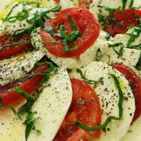 Caprese Salad · Fresh mozzarella, roma tomatoes, fresh basil, salt pepper, oregano, and extra virgin olive o...