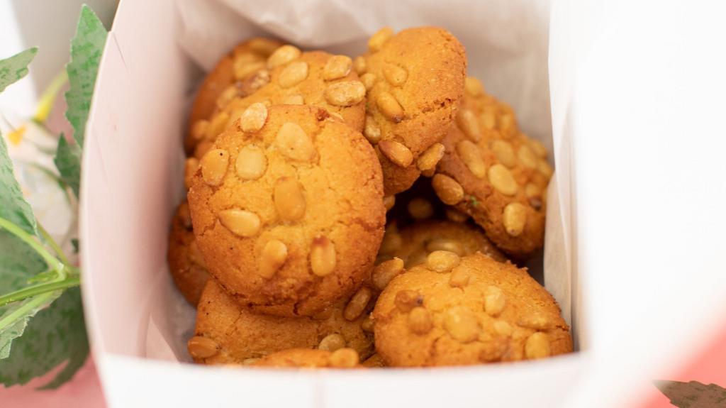 1Lb Of Pinioli Cookies  · It is a popular cookie in all of southern Italy, and in Sicilian communities. The cookie is a light golden color and studded with golden pine nuts. Made out of almond flour and coated in pine nuts (gluten free)