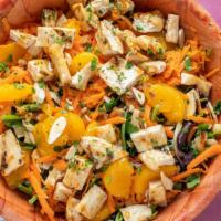 Asian Chicken Salad · Sliced teriyaki grilled chicken with Mandarin oranges, crispy noodles, sliced almonds and sh...