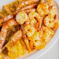 Crabegs & Shrimp Combo · Garlic Butter Crab legs & Shrimp served with Rasta pasta , Corn & Potatoes