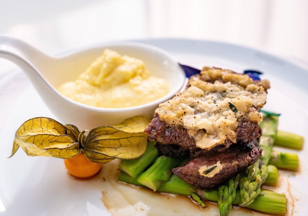 Petite Filet Mignon · Grilled to perfection and accompanied with wasabi butter.