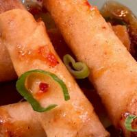 Shrimp Rolls 5 Pcs · Marinated shrimp wrapped with spring roll skin, served with sweet chili plum sauce.