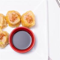 Pork Dumpling (4) · Steamed pork water chestnut, scallions, pepper, sesame oil, shitake mushroom.