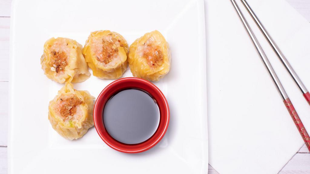 Pork Dumpling (4) · Steamed pork water chestnut, scallions, pepper, sesame oil, shitake mushroom.