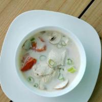 Tom Kha Chicken  · Coconut milk, lemongrass, kaffir lime, galangal, onion, mushroom, tomato.
