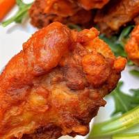 Crispy Chicken Wings · Six wings with your choice of sauce, your choice of dressing.