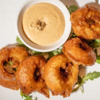 Beer-Battered Vidalia Onions · Milk Stout beer batter, thick cut onion rings, chipotle aoili