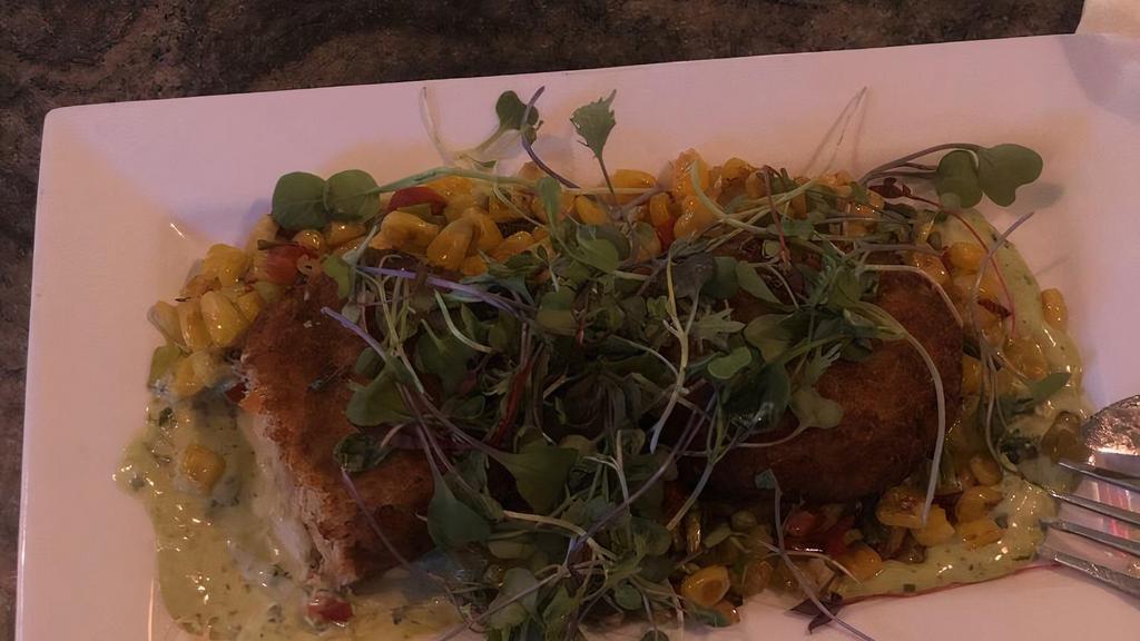 Crab Cakes · Two lump Maryland crab cakes with fresh corn relish and cilantro mayo.