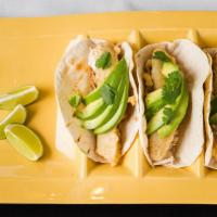 Fish Tacos · Tempura battered fish, coleslaw, avocado, cilantro and tartar sauce served on flour tortillas.