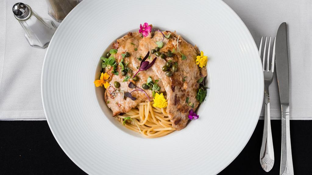 Veal Piccate · Veal cutlet, capers, lemon & demi-glace on a bed of spaghetti