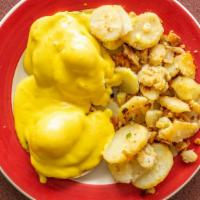 Eggs Benedict · Poached eggs and Canadian bacon on an English muffin with hollandaise sauce.  Served with ho...