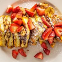 Nutella Crunch · Two pieces of home style challah bread French toast encrusted in granola crumbs. Stuffed wit...