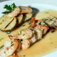 Camarones Al Ajillo · Con arroz blanco / Sautéed shrimp in garlic sauce served with white rice.