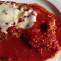 Chicken Parmigiana · Tomato sauce topped with fresh mozzarella.