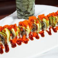 Pink Lady Roll · Yellowtail, tuna, salmon wrap with soy paper, sliced avocado and wasabi tobiko on top.