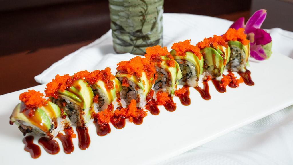 Pink Lady Roll · Yellowtail, tuna, salmon wrap with soy paper, sliced avocado and wasabi tobiko on top.