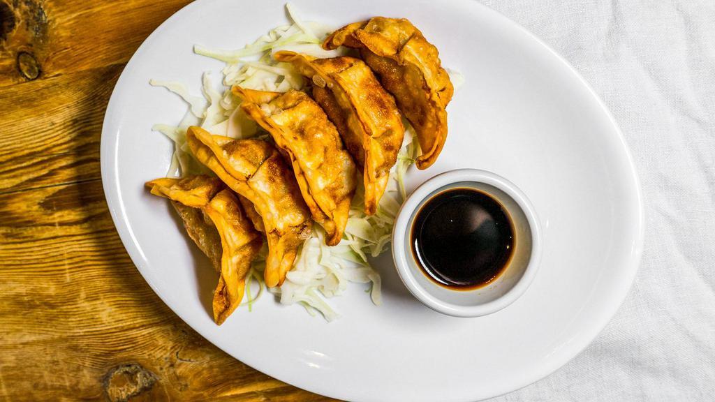 Pan Fried Dumplings · Choice of filling folded into fresh dumpling then pan-fried to perfection. Served with a basil garlic dipping sauce.