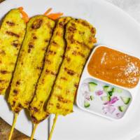 Satay (3 Pieces) · Choice of protein skewers marinated, satayed, and served with a peanut dipping sauce and cuc...