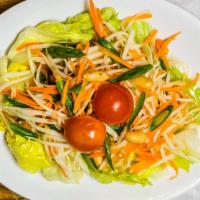 Thai Salad (Vegan) · Fresh greens tossed with bean curd and a side of peanut dressing.
