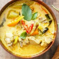 Green Curry · Hearty choice of meat served with eggplant, bamboo shoots, and lime leaves in a spicy coconu...