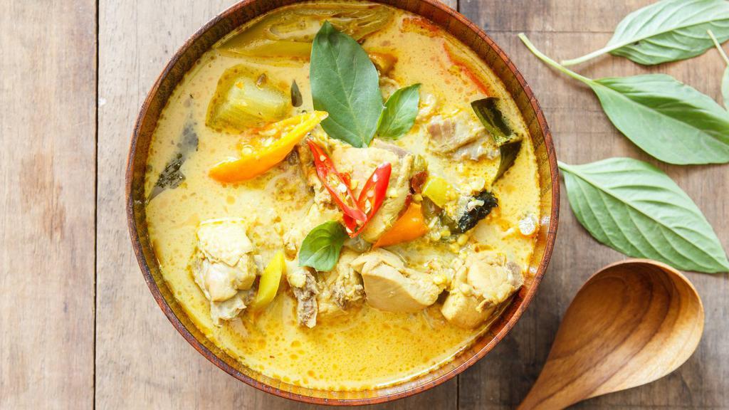 Green Curry · Hearty choice of meat served with eggplant, bamboo shoots, and lime leaves in a spicy coconut milk based curry and a side of Jasmine rice.