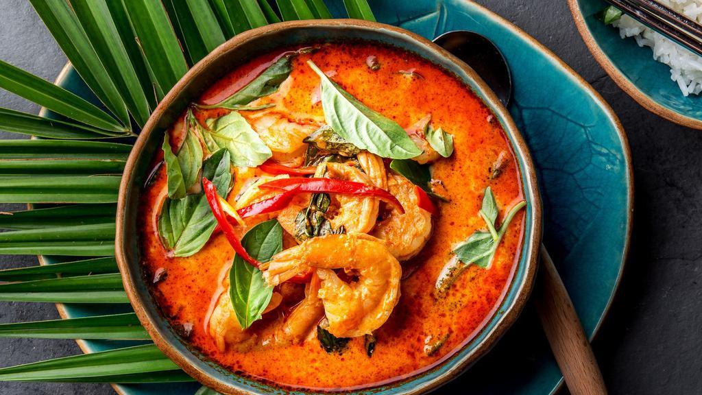 Red Curry · Hearty choice of meat served with peppers, bamboo shoots, pineapple, and Thai basil in a spicy traditional thick red curry and a side of Jasmine rice.