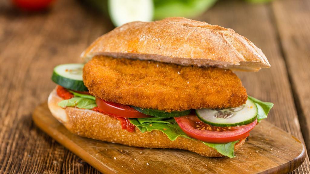 Chicken Cutlet Sandwich · Chicken Cutlet sandwich served with cheese, lettuce, and tomato.