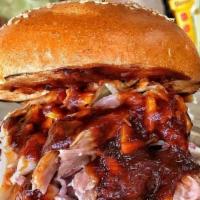 Pulled Pork Sandwich · pulled pork topped with cole slaw on a toasted sesame brioche bun