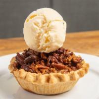 Bourbon Pecan Pie · sweet classic filling, bourbon-infused twist, whole pecans, vanilla ice cream
