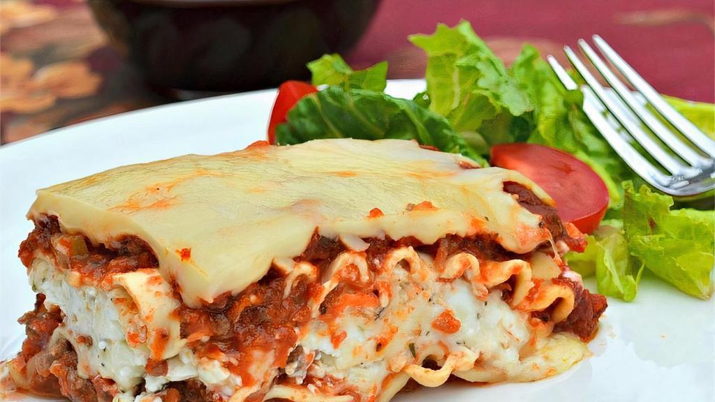 Meat Lasagna · Classic Italian lasagna layered with meat sauce and cheese.