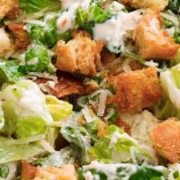 Caesar Salad · Romaine lettuce, croutons, parmesan cheese, and caeser dressing.