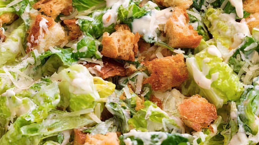 Caesar Salad · Romaine lettuce, croutons, parmesan cheese, and caeser dressing.
