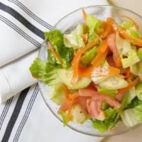 House Salad · Romaine lettuce, tomatoes, cucumber, shredded, carrots, and Italian dressing.