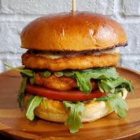Wild Caught Salmon Burger · Double Patty - 7oz House-Made Salmon Patty, Arugula, Tomato, Tartar Sauce