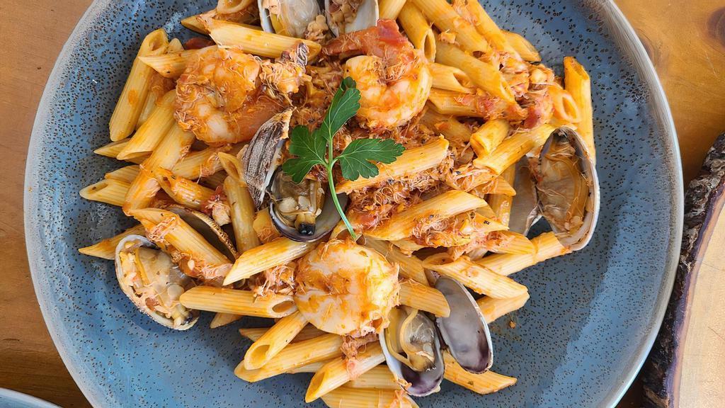 Pescatore Penne · Shrimps, clam, scallop, crab meat, tomato sauce.