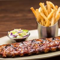 Bbq Grilled Baby Back Ribs · Baby back ribs is basted with BBQ sauce and served with French fries and coleslaw .