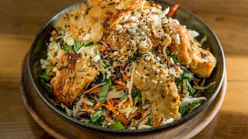 Herb Cabbage Salad With Chicken Satay · Green and purple cabbage with cilantro, mint, and Thai basil served with grilled chicken.