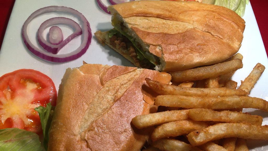 Chimi Sandwich Combo · Served with french fries and a can of soda.