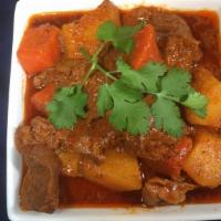 Res Guisada Combo · Beef stew. Served with rice, bean, and salad or french fries and salad or yellow plantain an...