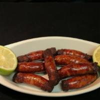 Longaniza Fritas · Eight pieces of fried sausage.