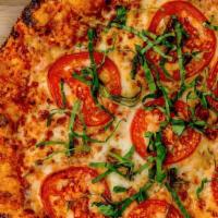Margherita · Traditional Crust / Tomato Blend / Mozzarella / Roma Tomato / Garlic Oil / Basil